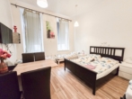 Wohn-/Schlafzimmer - Airbnb-​Apartment in guter Lage des 2. Bezirks!