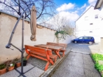 Außenbereich - Attraktive 3‑Zimmer-​Wohnung mit Gemeinschaftsgarten und Parkplatz